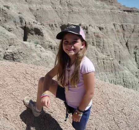 Junior Ranger Kylie Ferguson found a saber tooth cat fossil while on vacation in Badlands National Park. (Photo courtesy of National Parks Service)