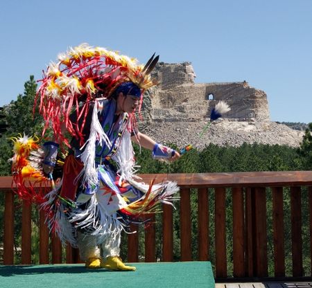 A Native American dancer performs in front of Crazy Horse Memorial in western South Dakota. (Photo courtesy of Crazy Horse Memorial)