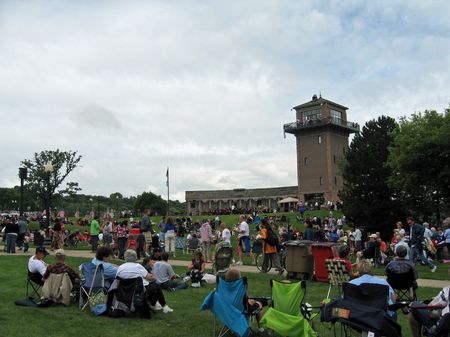 A crowd gathered at the Mayor's picnic at Falls Park to listen to the Sioux Falls Municipal Band, now in their 90th year.